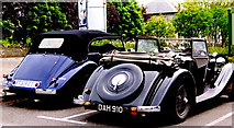 R2451 : Foynes - Flying Boat Museum - Two Classic Cars in Parking Area by Suzanne Mischyshyn