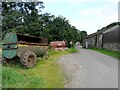 NY2250 : Agricultural equipment and an old barn by Rose and Trev Clough