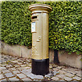 SJ9884 : Sarah Storey's Gold Postbox, Disley by David Dixon