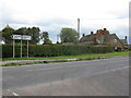 Junction of minor road onto the A417 Lechlade Road