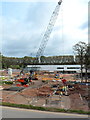 Towering crane jib in the Morrisons construction site, Cwmbran