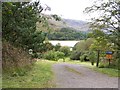 NN0247 : A glimpse of Loch Baile Mhic Chaillein at the entrance to Lochside Cottage by Elliott Simpson