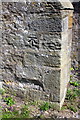 Benchmark on buttress of the Church of St Mary and St Alkelda