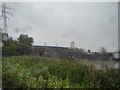 View of the old railway bridge and new footbridge from Bow Creek footpath