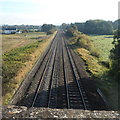 Railway east of a humpback bridge near Cam & Dursley railway station