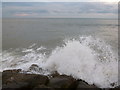 SZ2193 : Highcliffe: waves hit the breakwater by Chris Downer