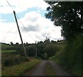 H6608 : Approaching a junction on a minor road north-west of Lough Tasker by Eric Jones