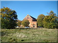 View of Woodford Green URC Church from the path by Potato Pond