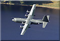 NT2422 : A low flying Hercules aircraft over St Mary's Loch by Walter Baxter