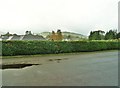 Looking across the A710 to distant hills