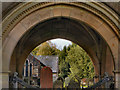NY8773 : St Mungo's Church and Lychgate Arch by David Dixon