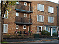 Public toilets occupy the corner of this block of flats