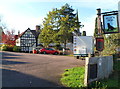 Black Dog pub car park and pub sign, Newent