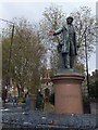 TQ3782 : Statue of Gladstone with red hand at Bow Church by David Smith