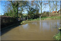 TF0534 : Walcot Ford in Flood by John Walton