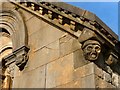 NS3979 : Smollett Mausoleum: carved heads by Lairich Rig