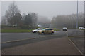 Roundabout and railway bridge in fog