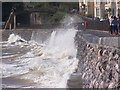 Dawlish Seawall with sea breaking over railway