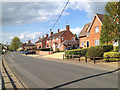 Houses in High Street, opposite a meadow