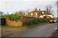 Boundary wall and house at Great Leys