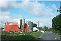 H6022 : Farm sheds and silos on the R183 west of Aghadrumkeen by Eric Jones