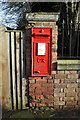 Benchmark below letter box on Charlbury Road