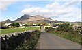 Ballyveaghmore Road rising uphill towards the junction with Sabbath Hill road