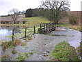 Footbridge across the flooded winterbourne