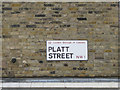 Street nameplate mounted on London brick