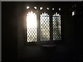 ST4698 : Morning sun coming through the leaded east window at Kilgwrrwg church by Jeremy Bolwell