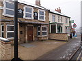 Empty pub and Fish & Chip shop in Woodford