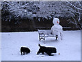 One snowman and his dogs