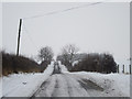 NU0435 : Country road east of Holburn Mill by Graham Robson
