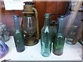 Hurricane lamp and old bottles, Plumbridge