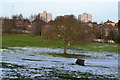 Remains of snow on recreation ground at edge of Bursted Wood