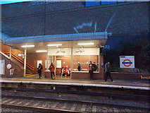 TQ3384 : Two clowns in the waiting room at Dalston Kingsland station by Robert Lamb