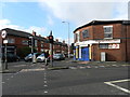 SJ9089 : Traffic light at junction, and business premises by Peter Barr