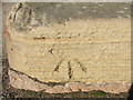 Bench mark on the base of Crich Cross