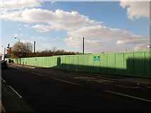 TQ4078 : Green hoarding on Woolwich Road by Stephen Craven