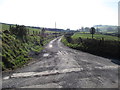J1522 : View south along the southern section of Carrick Road by Eric Jones