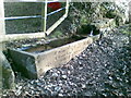 SJ9270 : Stone water trough with an inscription and a bench mark by John Harrison