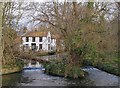 Weather-boarded buildings by the Wandle near Grove Mill