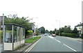 A bus stop and mini-roundabout on Church Road