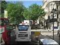 Buses and a white taxi in Colmore Row B3