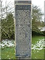 Tall story on the post of the village sign, Weston