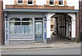 Old shop front, and entrance to Old Bells Court, showing timber framing