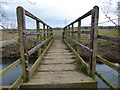 SP7590 : Footbridge across the River Welland by Mat Fascione