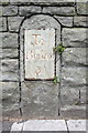 Old milestone in wall of Fishponds Road