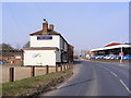 TG1107 : B1108 Watton Road & The Cock Public House by Geographer