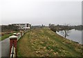 Footpath, flood wall and river